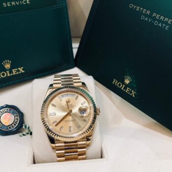 Gold Rolex Day-Date watch display